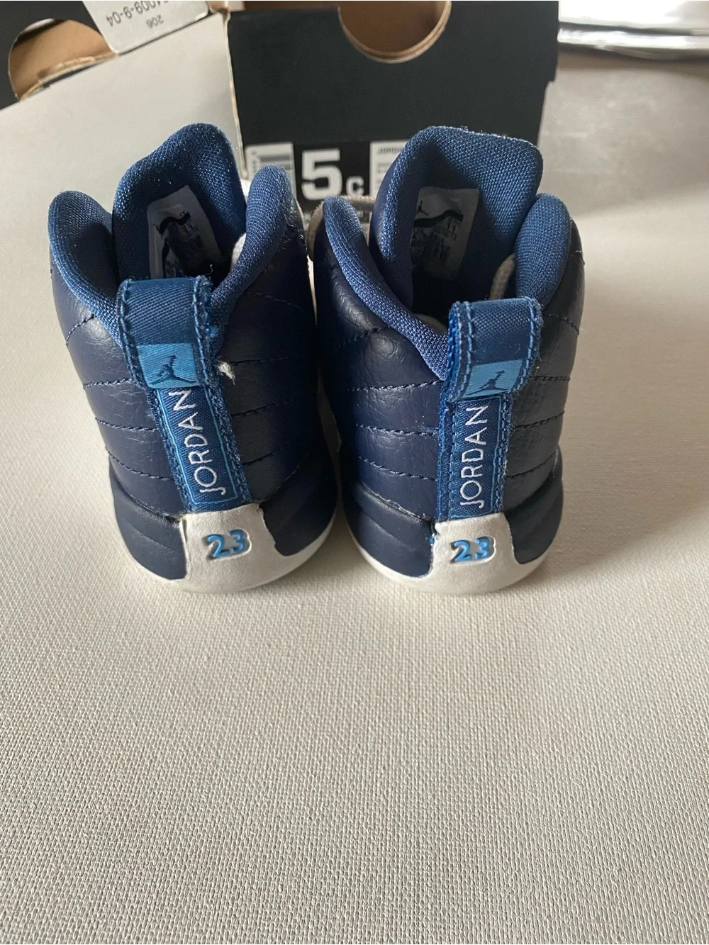 Nike Kids Navy and White Jordan 12’s